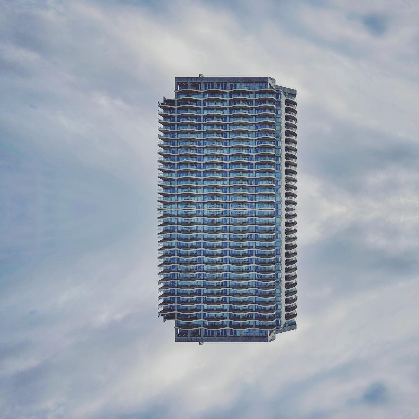 Floating skyscraper with multiple balconies