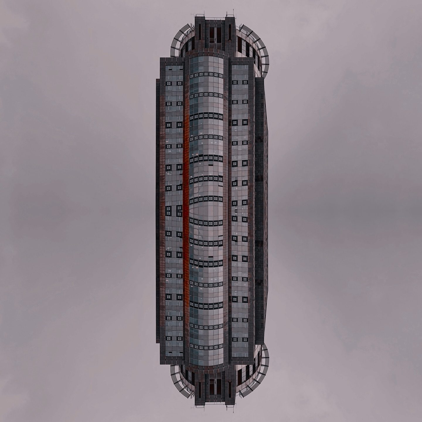 Futuristic skyscraper with cylindrical core and glass facade