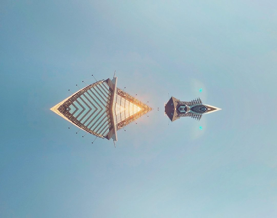 Two geometric floating structures in blue sky